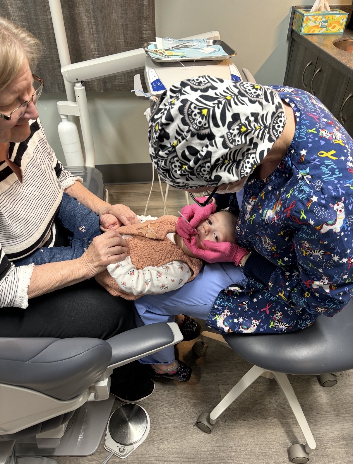 Gentle infant dental exam at First Smile